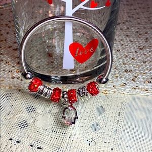 Silver Stretch Bracelet With Red & Silver Charms.